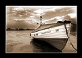 Picture Title - a coble sitting on boulmer beach on the north east coast of northumberland