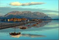 Picture Title - Reflections of beach hut and shades