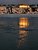 Winter scene photo : reflection of the light of the setting sun on the Saint-Laurent river in Levis, Quebec, Canada