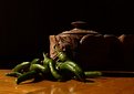 Picture Title - Still life with green peppers on wood