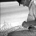 Picture Title - Pescatore - Riparare le reti