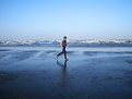 Picture Title - Man jogs at beach