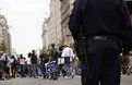 Picture Title - Policeman looks on marchers