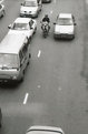 Picture Title - Middle of the road , the motorcyclist and the child