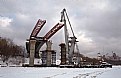 Picture Title - The floating crane on Moscow - river in the winter