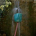 Picture Title - green bucket with red hose