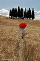 Picture Title - Red umbrella in the sun of Tuscany