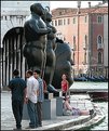 Picture Title - Girl that admires the proportions of the Botero statue