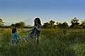 Picture Title - Woman and child in the sunset of a summer day