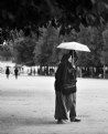 Man,woman, and an umbrella.