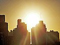 Picture Title - Sun Against Buildings