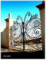 Picture Title - Art on an iron gate.