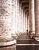 columns and lonely tourist at St Peters square in rome