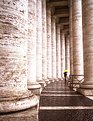 Picture Title - columns and lonely tourist at St Peters square in rome