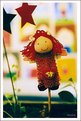 Picture Title - a little doll in a vase